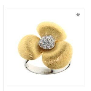 Large sterling blossom ring with rhodium plating.